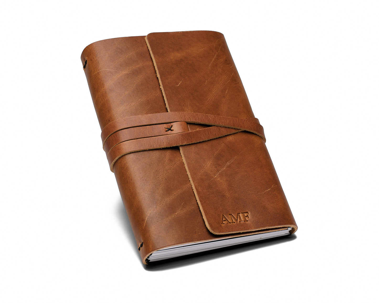 Three sample journals (tan, dark brown, black)