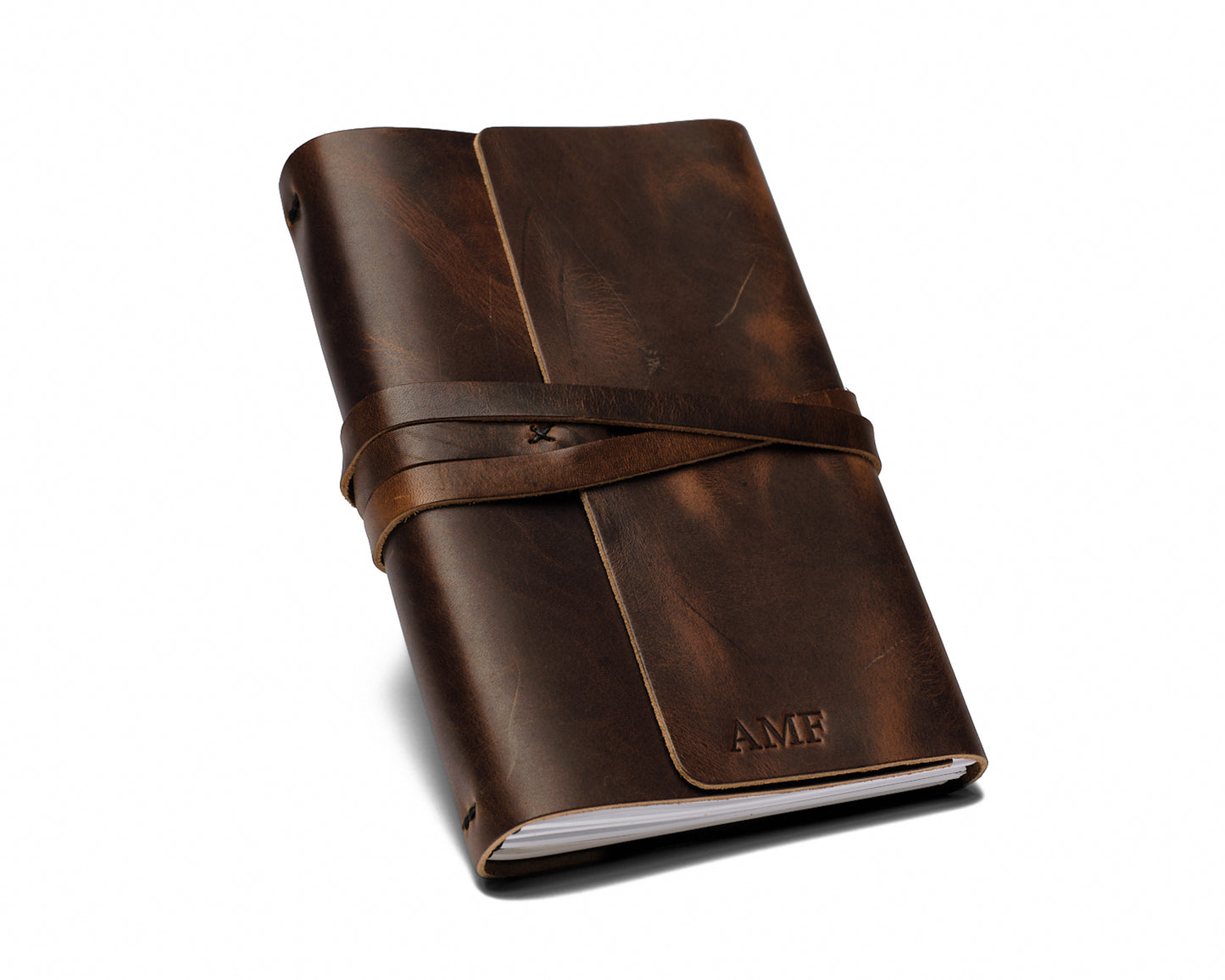 Three sample journals (tan, dark brown, black)