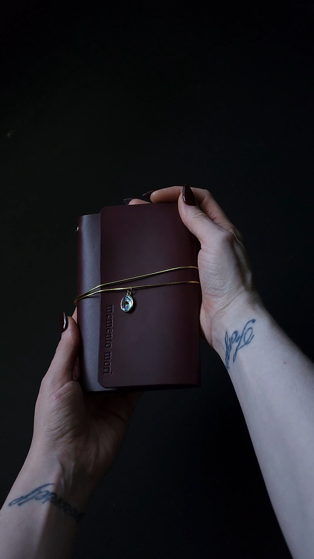 Oxblood trifold journal cover with gold elastics (one cover, no paper)