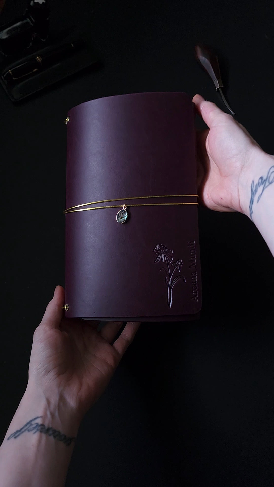 Oxblood trifold journal cover with gold elastics (one cover, no paper)