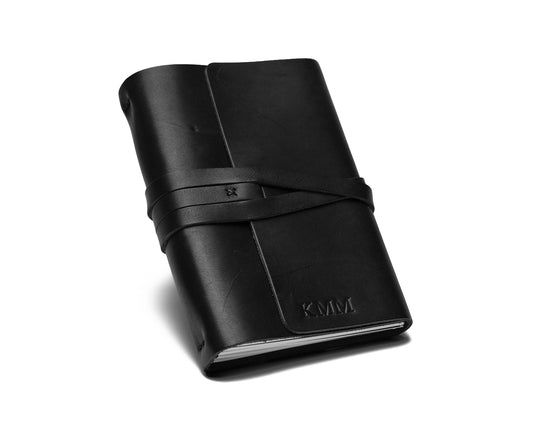 Three sample journals (tan, dark brown, black)
