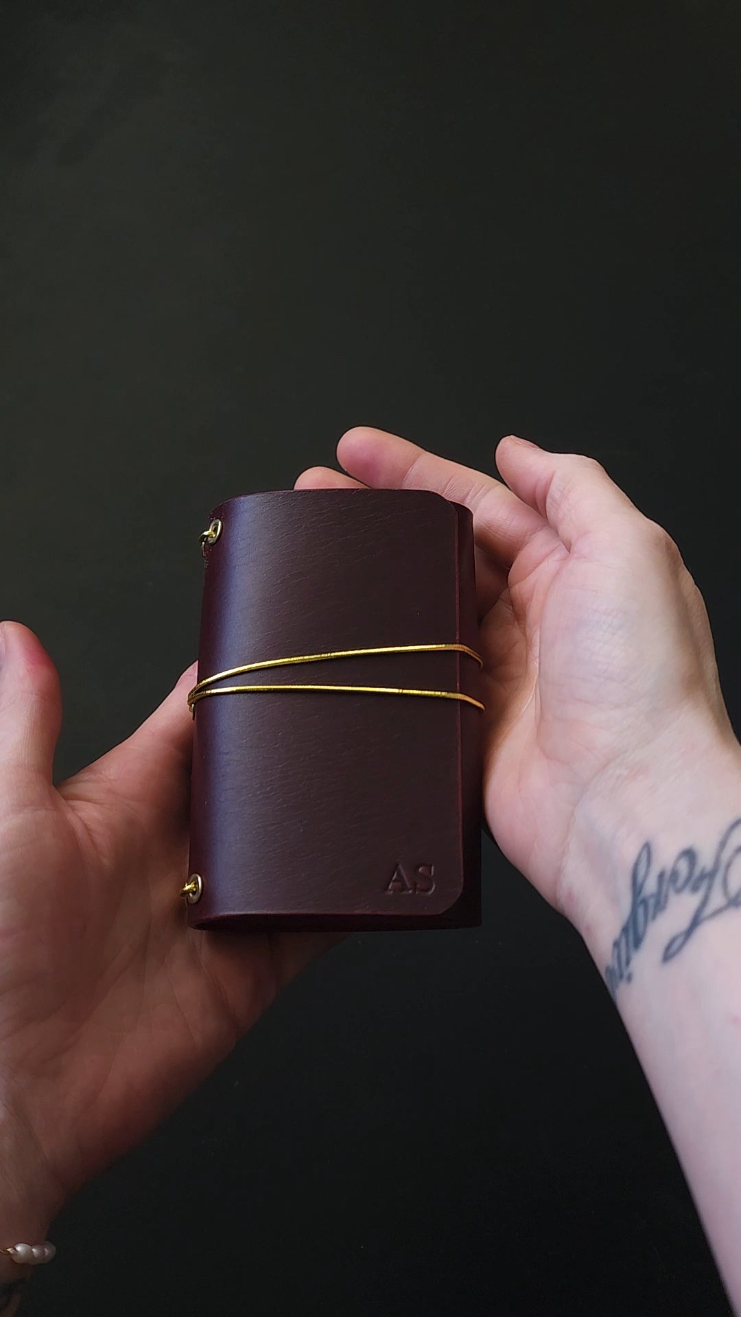 Oxblood trifold journal cover with gold elastics (one cover, no paper)