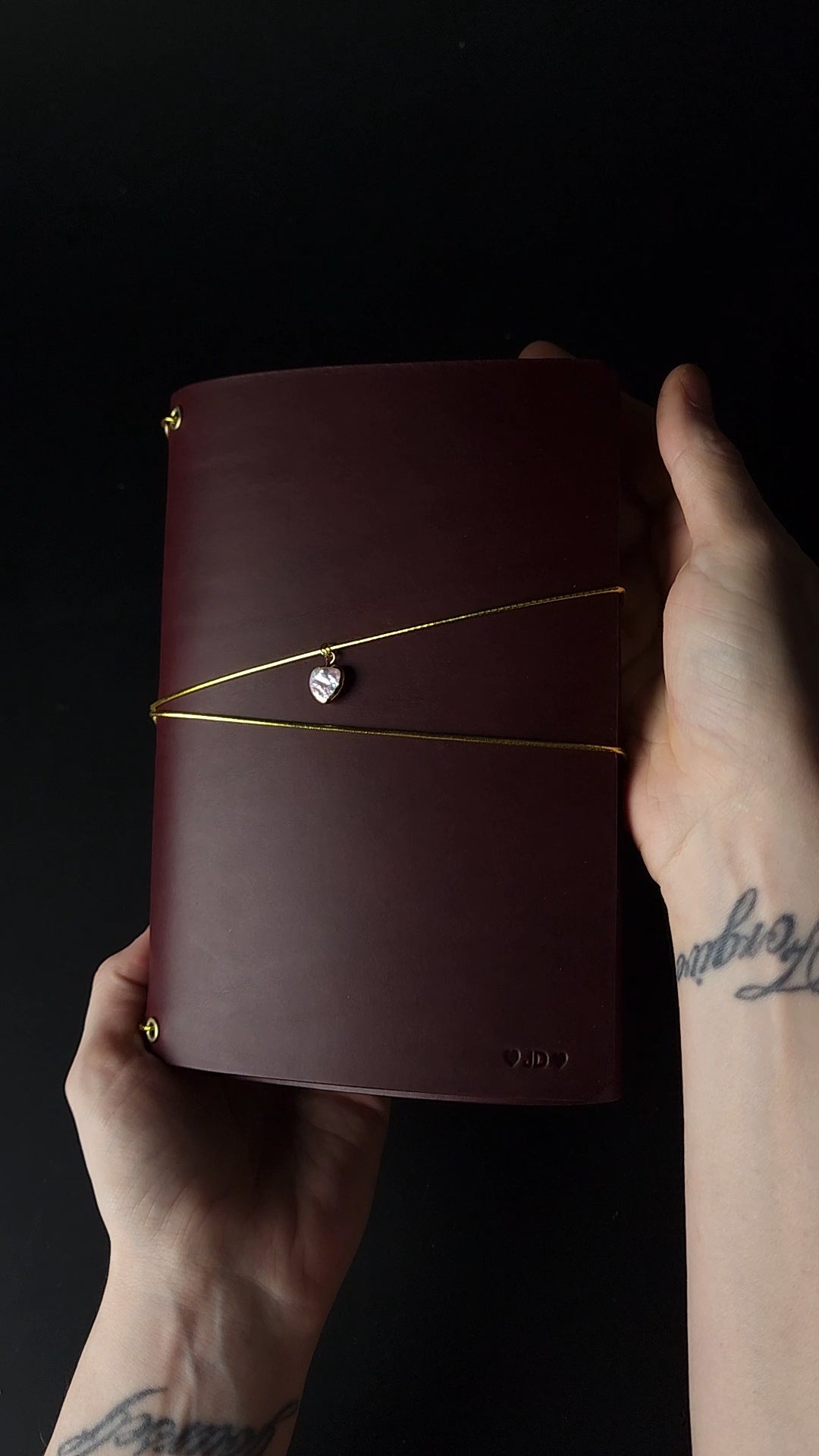 Oxblood trifold journal cover with gold elastics (one cover, no paper)