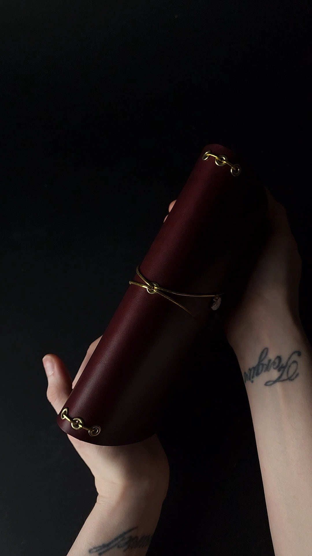 Oxblood trifold journal cover with gold elastics (one cover, no paper)