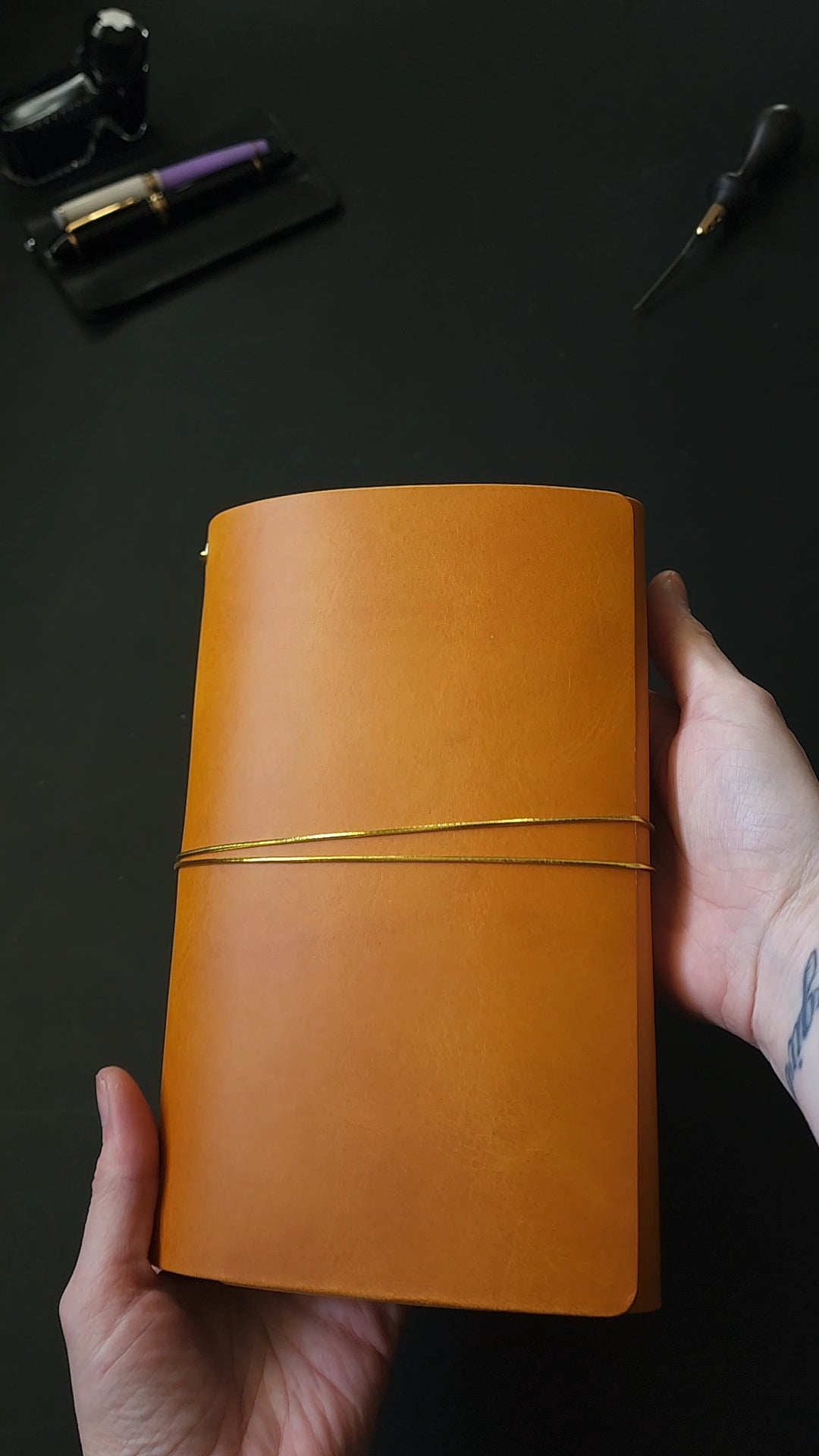 Oxblood trifold journal cover with gold elastics (one cover, no paper)