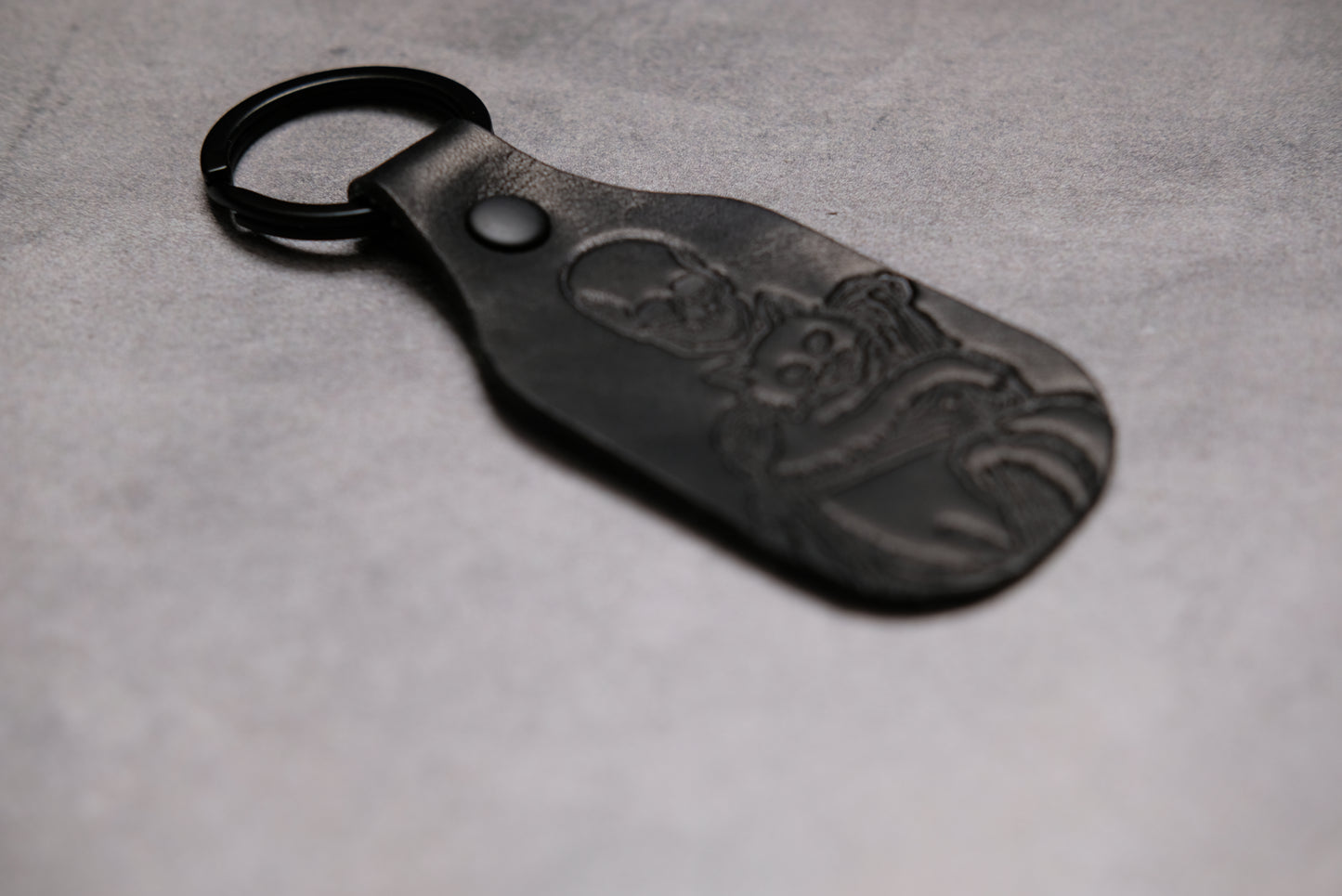 Skeleton holding a cat - Leather Keychain
