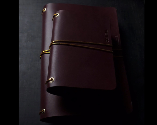 Oxblood trifold journal cover with gold elastics (one cover, no paper)