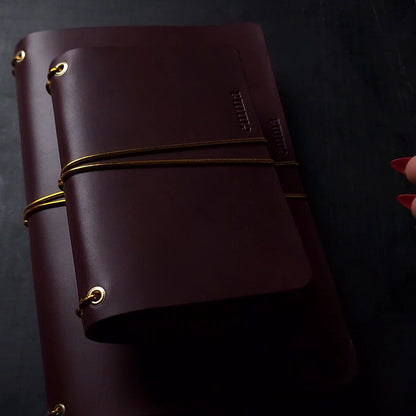 Oxblood trifold journal cover with gold elastics (one cover, no paper)