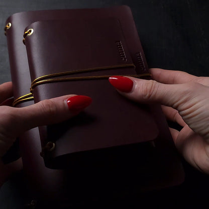 Oxblood trifold journal cover with gold elastics (one cover, no paper)